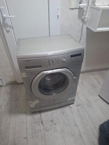 Regal paltaryuyan maşın – ön yükləməli, gümüşü rəng. Xüsusiyyətlər: -