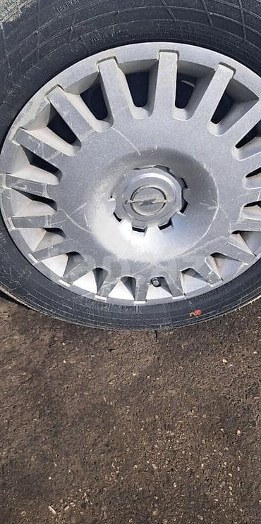 Автозапчасти: Б/у Колпак Opel R 16 — 2
