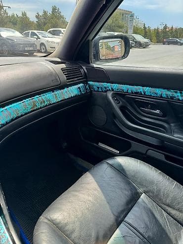 tesla model s: BMW 7 series: 3.5 l | 1996 il Sedan — 9