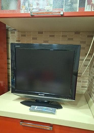 Televizorlar: Sharp Aquos LCD televizor - Ekran: təxminən 24–26 düym, geniş ekran - — 1