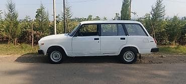 Avtomobil: Lada 2104 (universal), ağ rəng Kuzov: 5 qapı, geniş baqajlı — 3