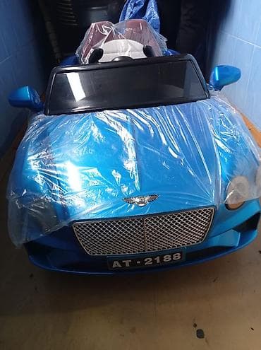 uwaq mawini: Uşaq üçün elektrikli ride-on avtomobil – mavi rəngdə kabriolet dizayn — 1