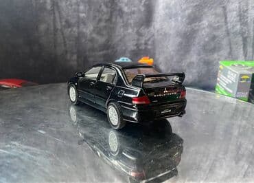 maşın modeli: Коллекционная модель Mitsubishi Lancer Evolution VII black 2002 — 10