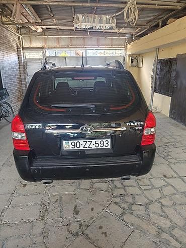 larzon disk: Hyundai Tucson CRDi – dizel, avtomat, qara rəngli kompakt SUV. Əsas — 1