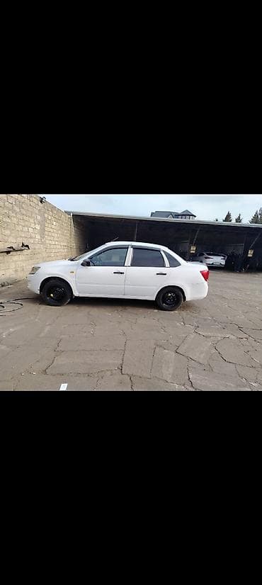 volkswagen passat b6: VAZ (LADA) Granta: 1.6 l | 2012 il 310000 km Sedan — 5