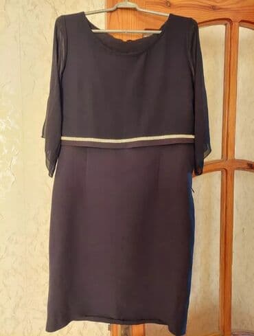 Moskviç: Qadın paltarı – qısa, tünd rəngdə, klassik siluetli. - Model: düz — 1