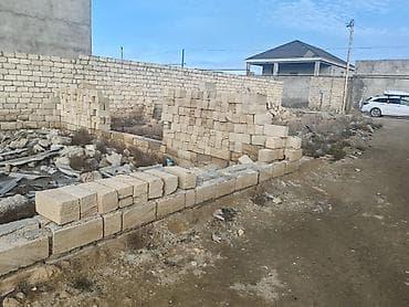 Tavan: Satılır: tikinti üçün daş materialı və yarımçıq bünövrə/karkas - — 1