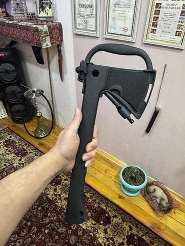 Balta cantasi caxmaqi arxasinda sapina yerlesdirilen bicaq. Hediyyelik