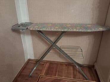 Ütü masasının təsviri - Geniş, uclu formalı ütüləmə səthi – rəngarəng