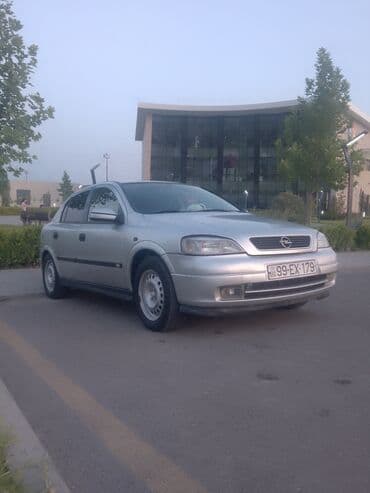 gence emlak heyet evleri: Opel Astra sedan/hatchback (gümüşü rəng). Detallar: - Kuzov: gümüşü — 1