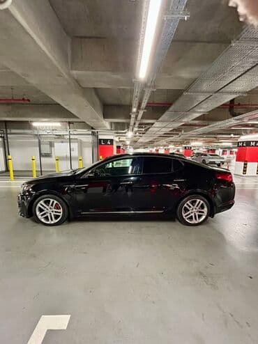 xrom diski: Kia Optima – qara rəng, sedan kuzov. Şəhərdaxili və magistral yollarda — 9