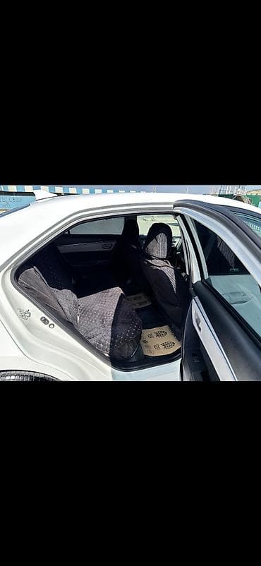 corolla cros: Toyota Corolla, ağ rəng,sedan gövdə. I - Nömrə nişanı: 99-KY-573 — 9