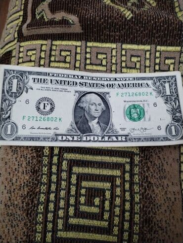 Velosiped aksesuarları: Məhsul: ABŞ 1 dollar banknotu. Cap zamani 2 balaca nöqtə cernil düşüb — 2