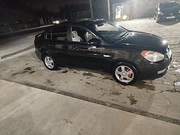 sonata disk: Hyundai Accent sedan – qara rəng, 4 qapı, AZ nömrə nişanı (77 NC 610) — 1