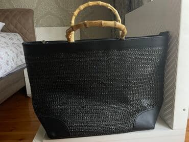 qaşlı çanta: Stradivarius böyük həsir çanta.Kənarları kojadır,qulpu bambukdur.1 — 2