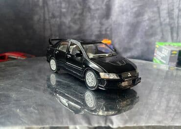 maşın modeli: Коллекционная модель Mitsubishi Lancer Evolution VII black 2002 — 5