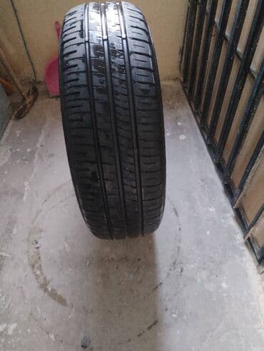 Автозапчасти: Шина Dunlop 185 / 60 / R 15 — 4