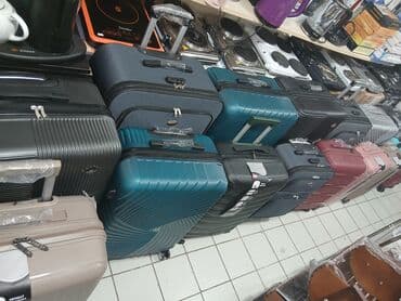 купить чемодан на колесах: Dörd təkərli səyahət çantası, möhkəm materialdan hazırlanmışdır və — 17