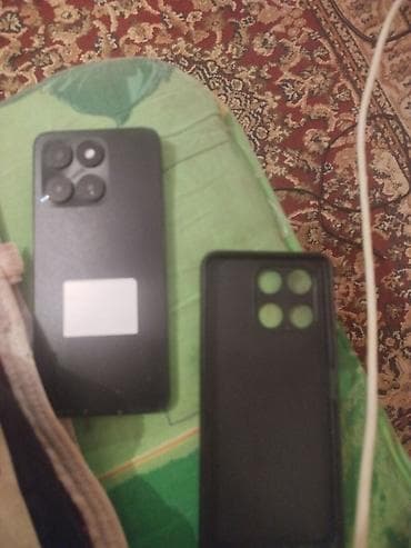 telofonlu saat: Məhsul: Android smartfon Təsvir: - Tam ekranlı displey, üst mərkəzdə — 2