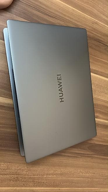 apple notebook: Huawei noutbuk – şık boz metal gövdə, incə və yüngül dizayn. Əsas — 2