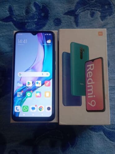 Redmi 9 smartfonu, qara rəngdə, öz qutusunda və sənədləri ilə təqdim