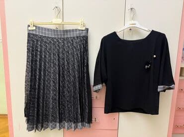 Şəffaf qara rəngli üst qatlı, qara və ağ damalı astarlı plisəli ətək