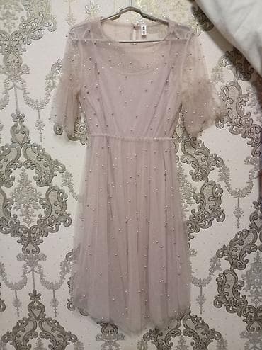 qol saat sekilleri: Zərif şifon/tyul materialdan hazırlanmış, açıq pudra rəngində qadın — 1