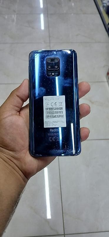 ucuz macbook: Xiaomi Redmi smartfon - Model: Redmi (arka qapaqda “Redmi” loqosu) — 2