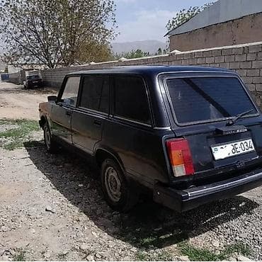 ucuz maşin: Model: LADA 2104 (universal kuzov) Rəng: qara Yanacaq: benzin Ötürücü — 2