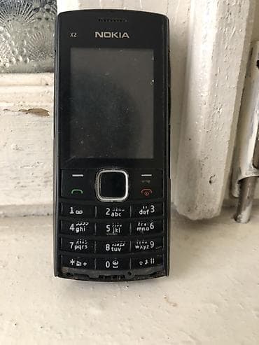 Аудиотехника: Nokia X2 Dual Sim, цвет - Черный, Кнопочный — 1