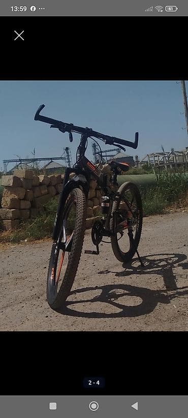 velosibed: MTB tipli dağ velosipedi - Brend/seri yazısı: BMB (kadr üzərində qeyd — 3