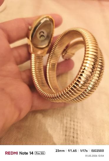 Qadın qol saatı – “ilan/spiral” dizaynlı, qızılı rəng. - Korpus — 3