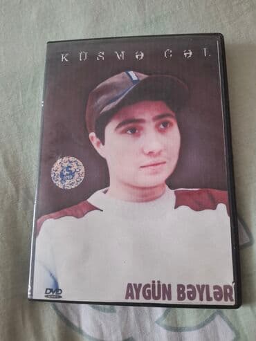 retro televizor: Aygün Bəylərin iştirakı ilə "Kosməkçi" DVD diski. Diskin üzərində — 1