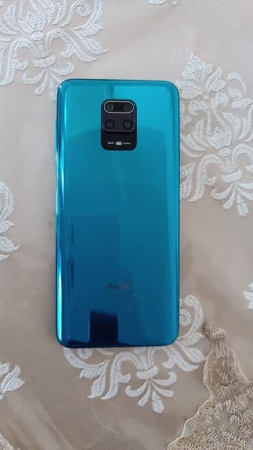 вытяжка для кухни в баку: Arxa tərəfində kvadrat formalı kamera modulu olan parlaq firuzəyi — 1