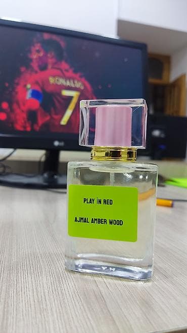 epoxy saat: Məhsul: “Play in Red – Ajmal Amber Wood” ətir ekstraktı Təsvir: - — 1