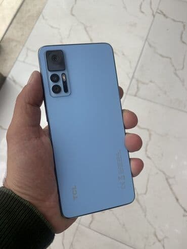 ucuz plansetler qiymeti: TCL T676Hsmartfon - Rəng: açıq mavi arxa panel, mat tekstura, metal — 1