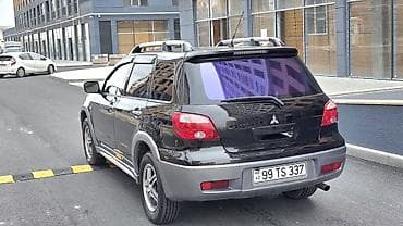 qara maşın: Mitsubishi Outlander – şəhər və yolsuzluq üçün praktik krossover. - — 7
