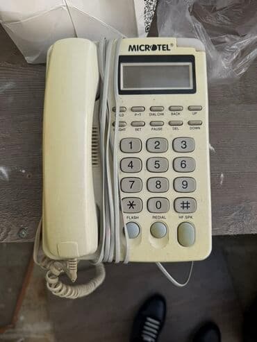 Stasionar telefon Simli