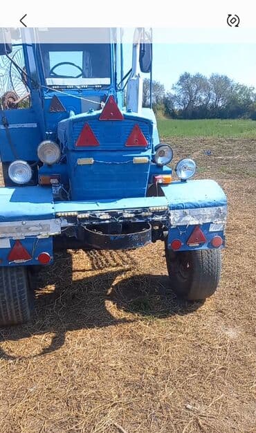 maşın ucun işıqlar: Mavi rəngdə kənd təsərrüfatı traktoru Əsas xüsusiyyətlər: - Ön — 1