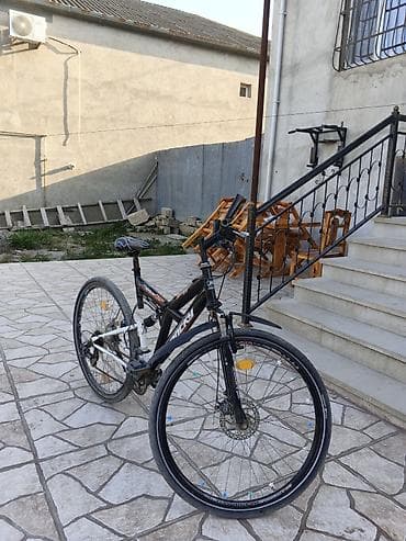 Şəhər velosipedləri: MTB tipli velosiped - Brend/model: Rockrider stili, “Rocky” yazılı — 1