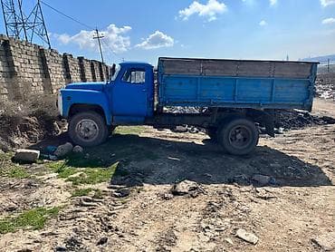 vaz oka satilir: Məhsul: Yük maşını – mavi rəngli, yanları taxta uzadılmış üçtərəfli — 1