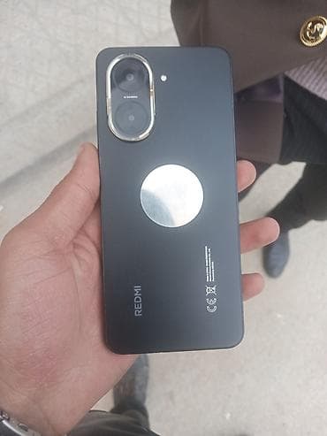 Smartfon (Redmi a5) – düz kənarlı korpus, böyük dairəvi arxa kamera — 6