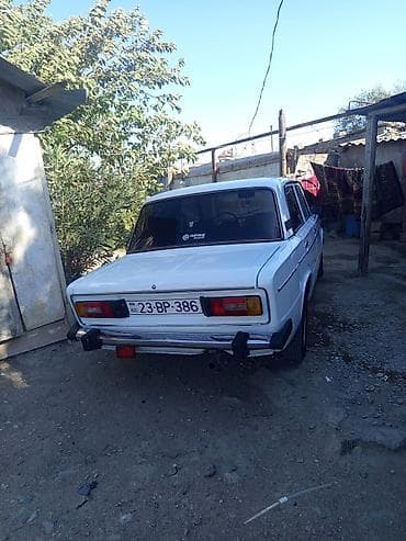 cobalt disk: VAZ 2106, ağ rəng, sedandır. Klassik kuzov dizaynı, xrom ön barmaqlıq — 9