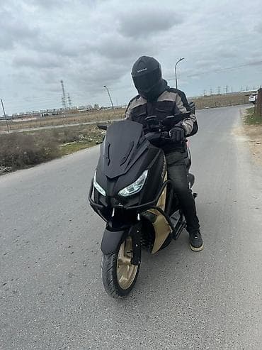 skoter: Şəhər içi və qısa məsafələr üçün rahat skuter/moped. Xüsusiyyətlər: - — 1