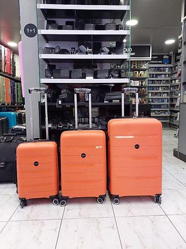 Çamadanlar: Portağal rəngli sərt korpuslu çamadan dəsti (3 ölçü) - Korpus: yüngül — 1