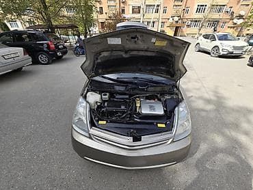 hyundai satilir: Toyota Prius (2-ci nəsil) hibrid hetçbek - Qizili rəng, 5 qapı - — 8