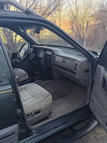 qezali avtomobil: Jeep Grand Cherokee: 4 l | 1993 il Ofrouder/SUV — 7