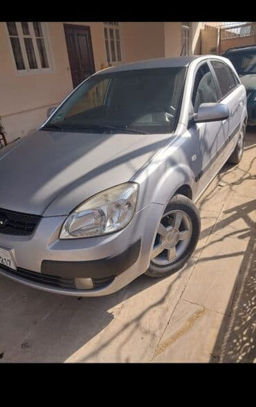 Математика: Model: Kia Rio (sedan), gümüşü rəng Kuzov: 4 qapı, aerodinamik — 3