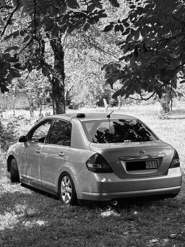 mersedes disk r15: Nissan Tiida: 1.6 l | 2006 il Sedan — 6
