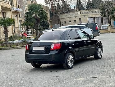 опель зафира а: Kia Rio: 1.4 л | 2011 г. Седан — 9